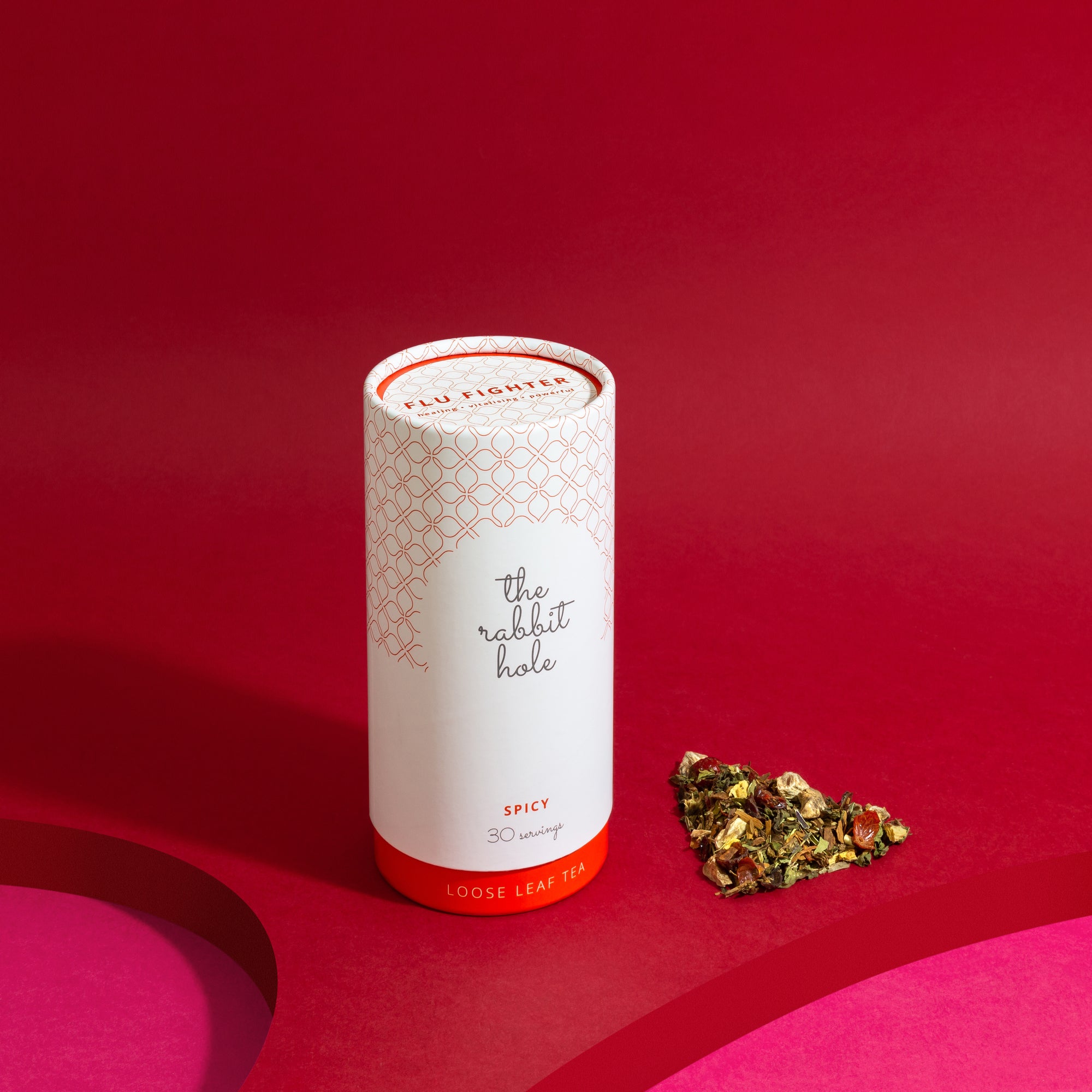 Flu Fighter loose leaf tea by The Rabbit Hole - Australian Made Tea. Tea canister on colourful red background
