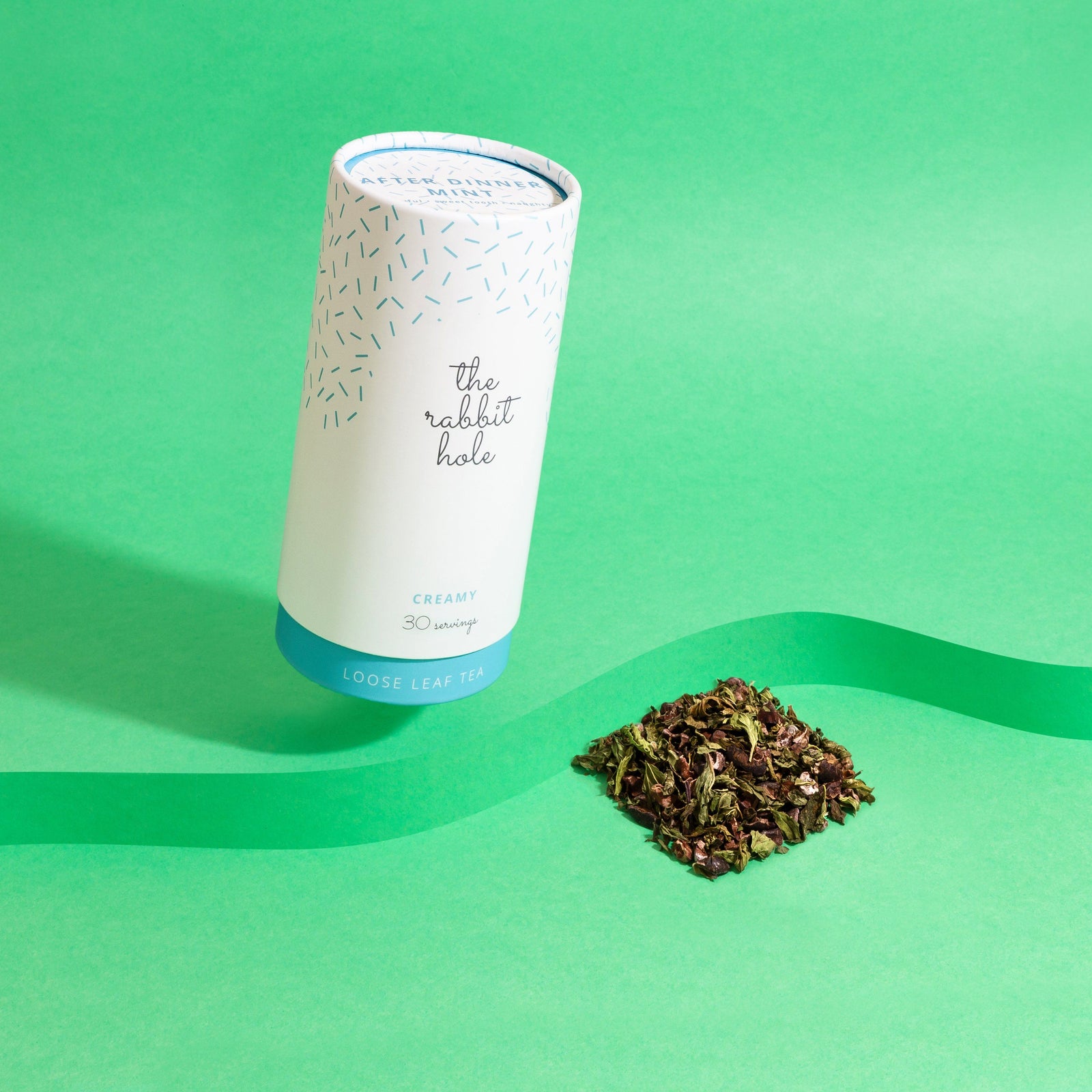 After Dinner Mint loose leaf tea by The Rabbit Hole - Australian Made Tea. Tea canister on colourful green background 