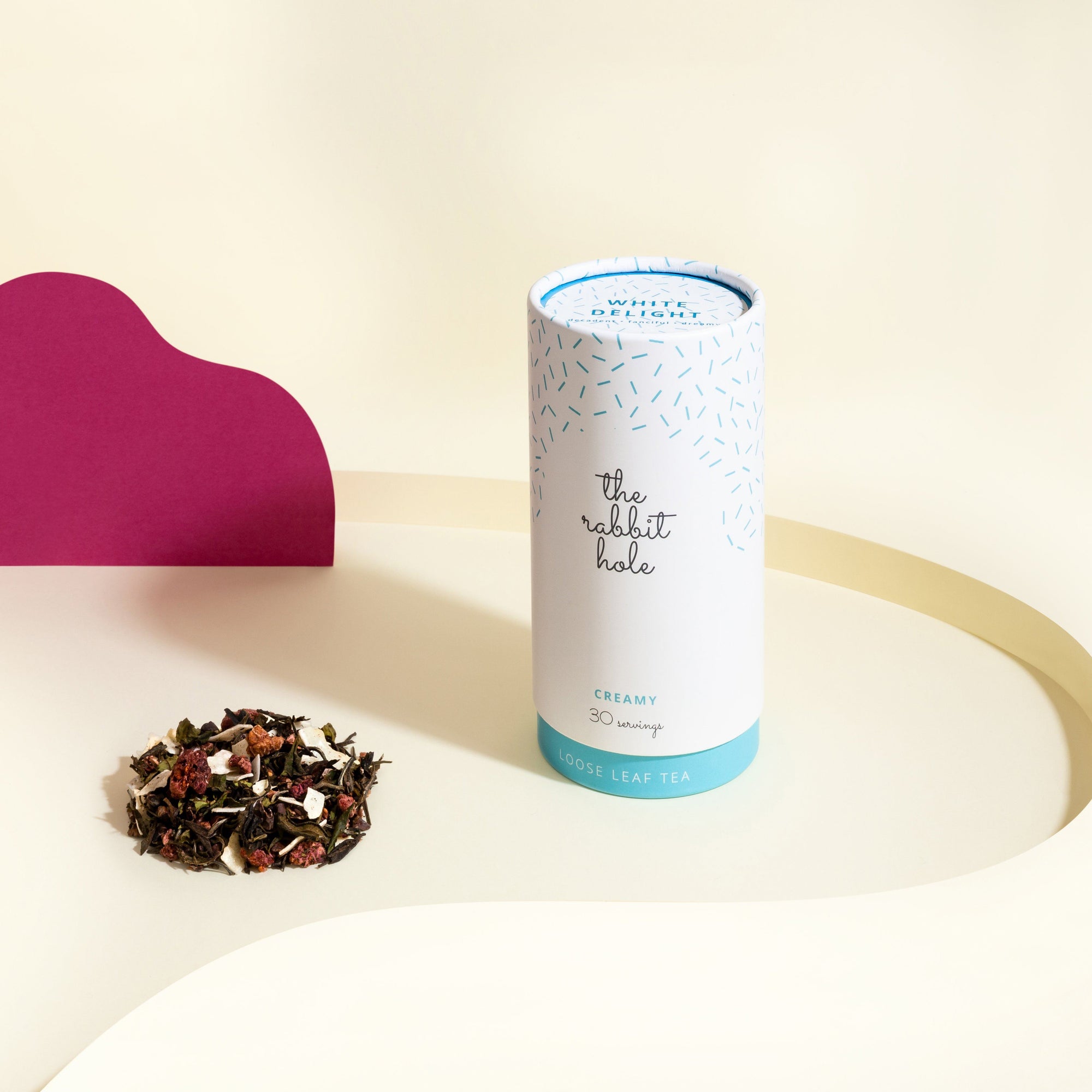 White Delight Canister Creamy loose leaf tea by The Rabbit Hole - Australian Made Tea - pink and pale yellow background