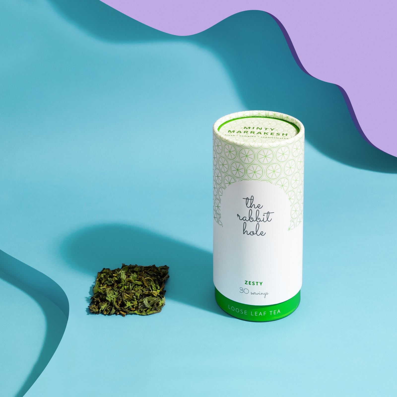 Minty Marrakesh loose leaf tea by The Rabbit Hole - Australian Made Tea. Tea canister on colourful blue background