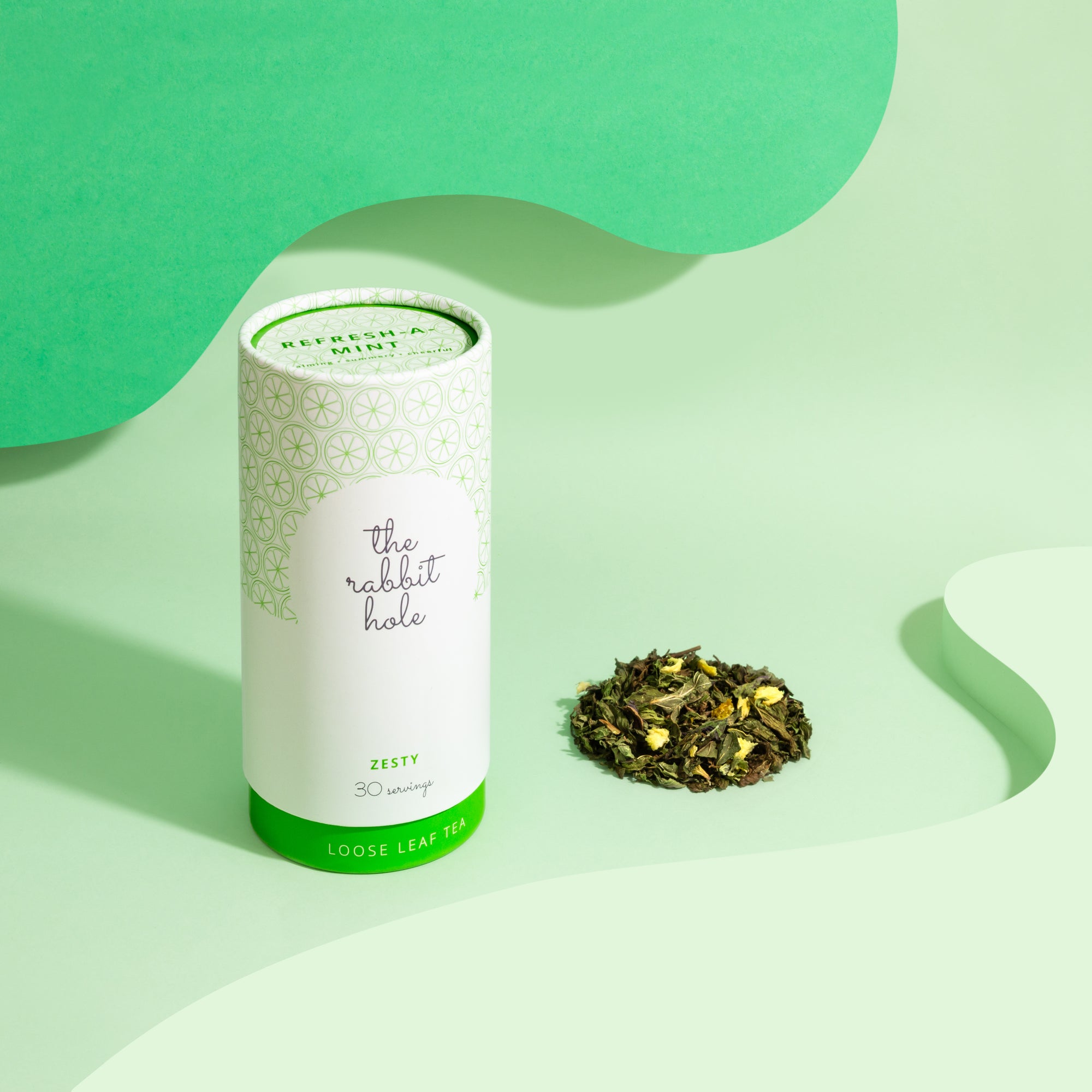 Refresh-a-mint loose leaf tea by The Rabbit Hole - Australian Made Tea. Tea canister on colourful green background