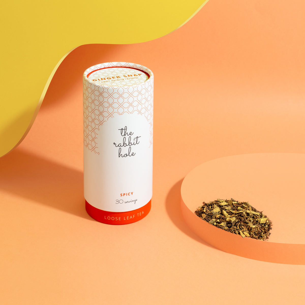 Ginger Snap loose leaf tea by The Rabbit Hole - Australian Made Tea. Tea canister on colourful orange background
